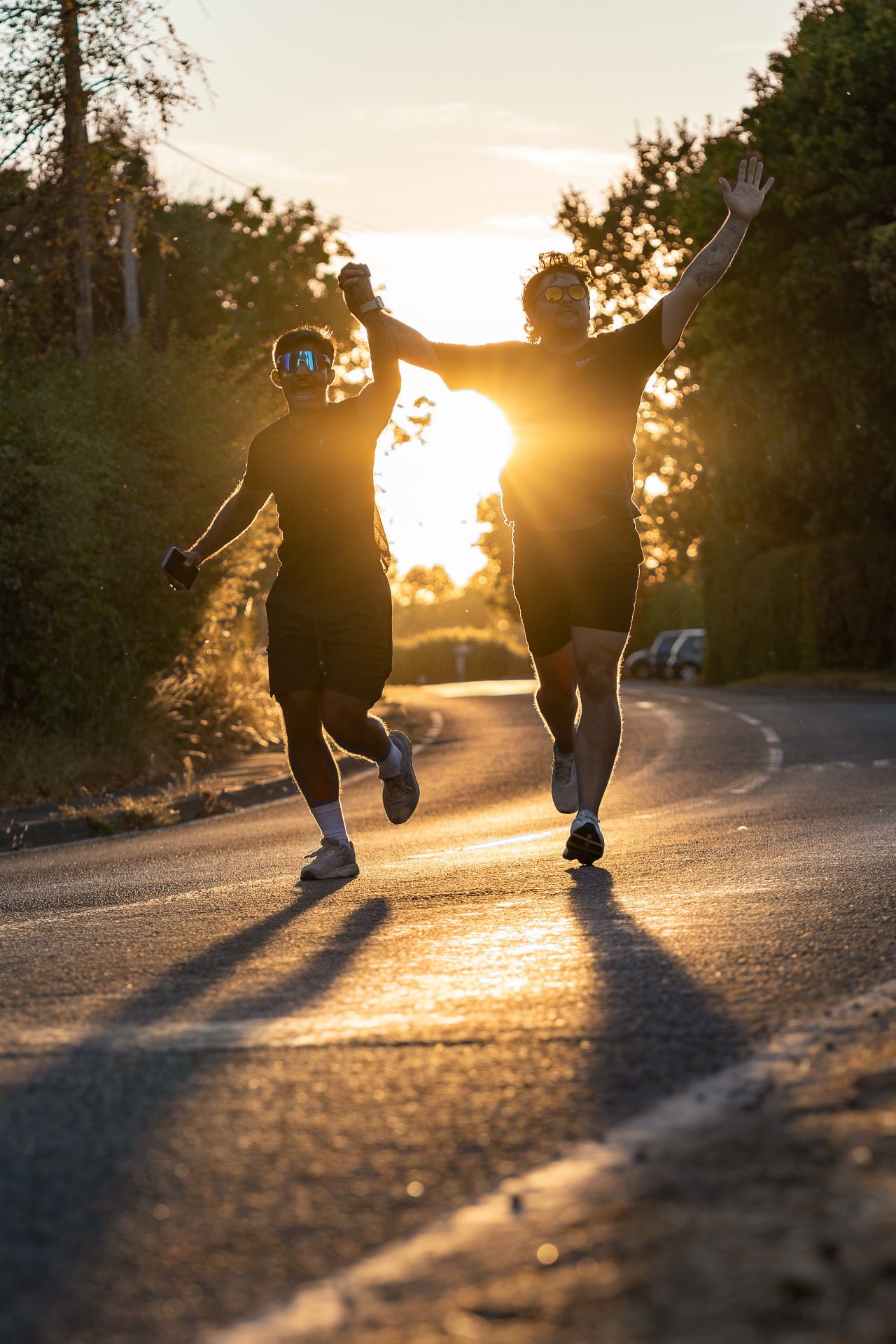 Two men finishing a sunset run at a NERVA community event in Hampshire