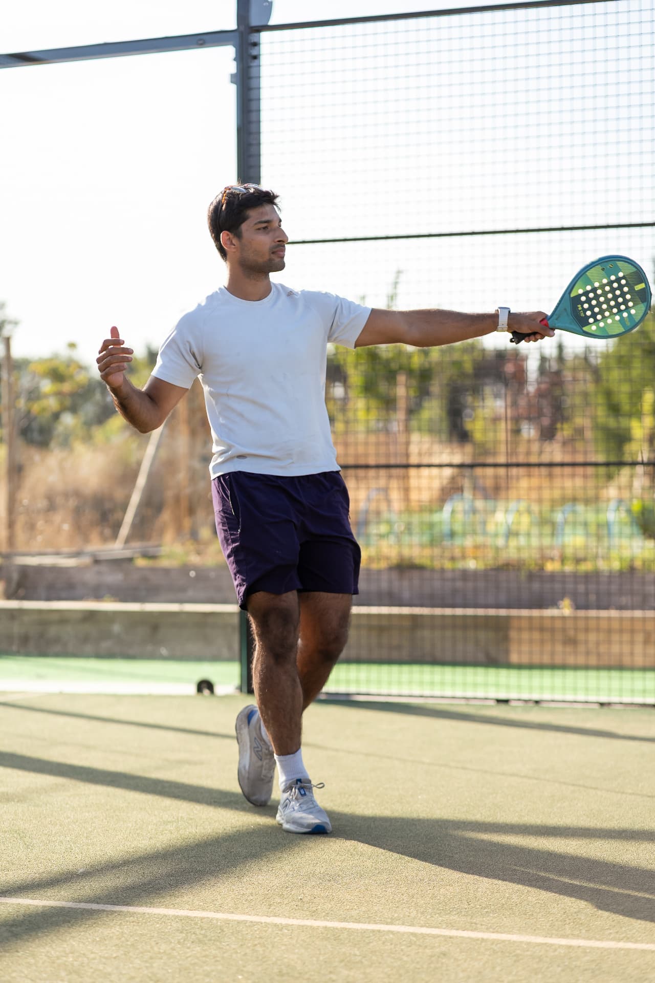 Man playing padel during a NERVA community meet-up in Hampshire
